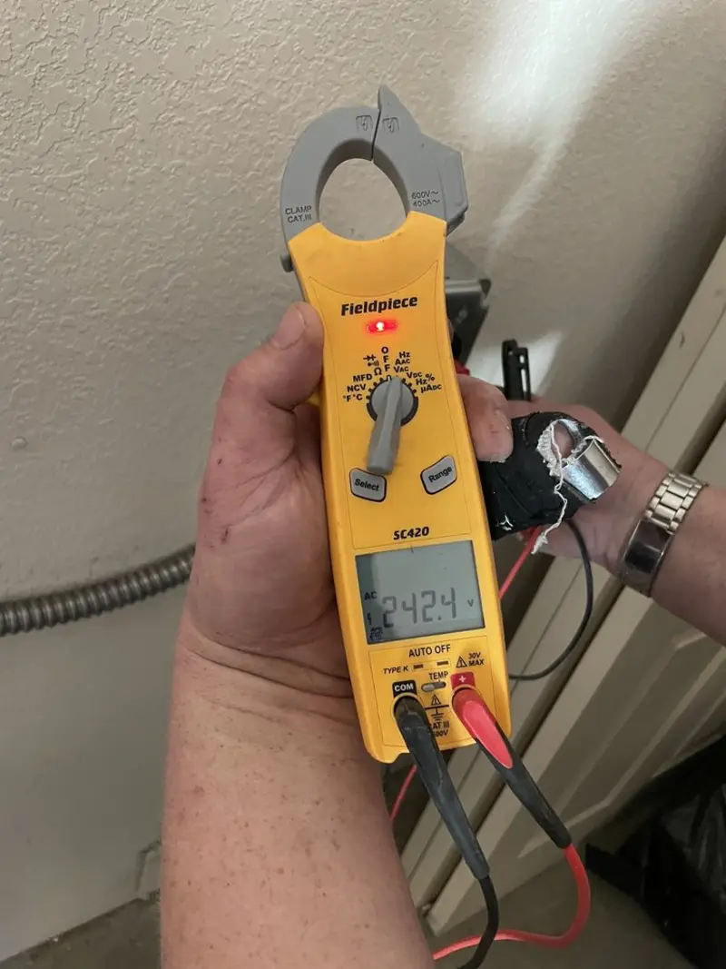 Voltage testing with clamp meter during Outlet Installation in Millington